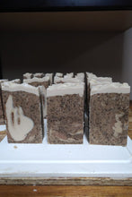 Load image into Gallery viewer, Our signature Guinness-based soap bars are busy curing. These soaps are cured for no less than 6 weeks which allows each bar to mature to it's fullest.